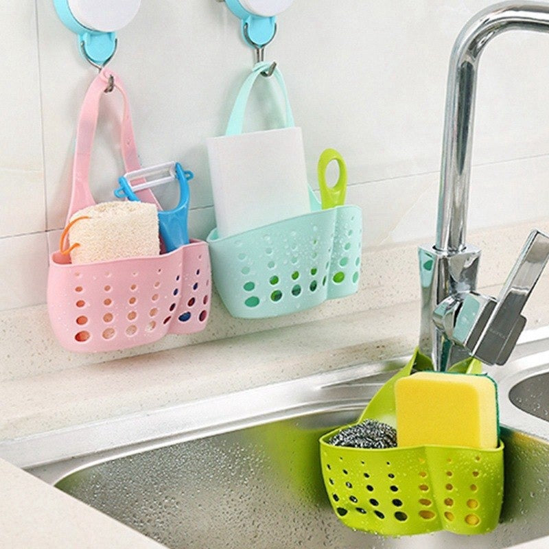 Adjustable plastic basket for kitchen sink, perfect for drainage and organizing small items. Adjustable plastic basket for kitchen sink, perfect for drainage and organizing small items.